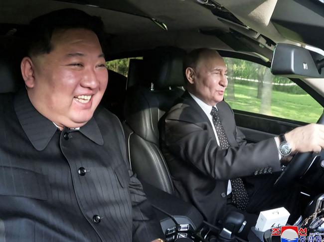 TOPSHOT - This picture taken on June 19, 2024 and released on June 20, 2024 from North Korea's official Korean Central News Agency (KCNA) via KNS shows North Korea's leader Kim Jong Un (L) sitting in the passenger seat of a car driven by Russia's President Vladimir Putin (R) in the garden of the Kumsusan State Guesthouse in Pyongyang. (Photo by KCNA VIA KNS / AFP) / South Korea OUT / ---EDITORS NOTE--- RESTRICTED TO EDITORIAL USE - MANDATORY CREDIT "AFP PHOTO/KCNA VIA KNS" - NO MARKETING NO ADVERTISING CAMPAIGNS - DISTRIBUTED AS A SERVICE TO CLIENTS THIS PICTURE WAS MADE AVAILABLE BY A THIRD PARTY. AFP CAN NOT INDEPENDENTLY VERIFY THE AUTHENTICITY, LOCATION, DATE AND CONTENT OF THIS IMAGE. /