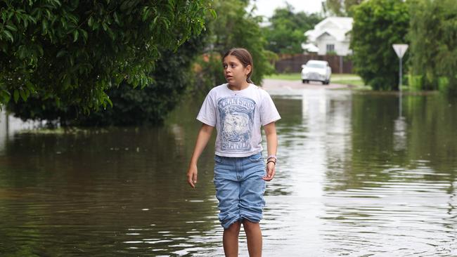 TOWNSVILLE, AUSTRALIA - NewsWire Photos - February 3, 2025: Annabella Giorgas 11 walks along her street in Hermit Park as Townsville residents endure another day of heavy rain and threats of catastrophic flooding. Picture: Adam Head /NewsWire