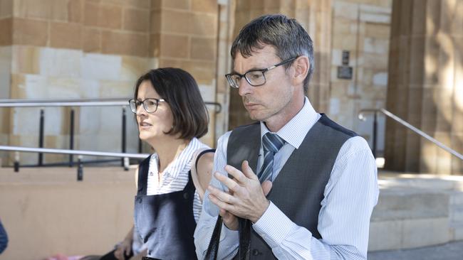 Christopher Hocking and a supporter leave court on Tuesday. Picture: Brett Hartwig