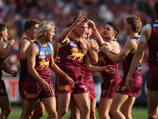 MELBOURNE, AUSTRALIA - SEPTEMBER 28: Logan Morris of the Lions celebrates kicking a goal during the AFL Grand Final match between Sydney Swans and Brisbane Lions at Melbourne Cricket Ground, on September 28, 2024, in Melbourne, Australia. (Photo by Daniel Pockett/AFL Photos/Getty Images)