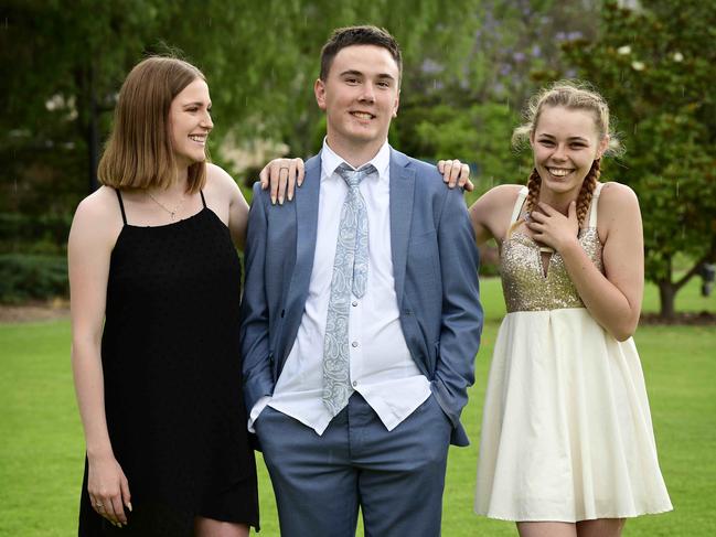 STRIVING: High school graduates Tahmika Richardson, Micheal Robertson and Indiana Reese-Loffler at Government House. Picture: Bianca De Marchi