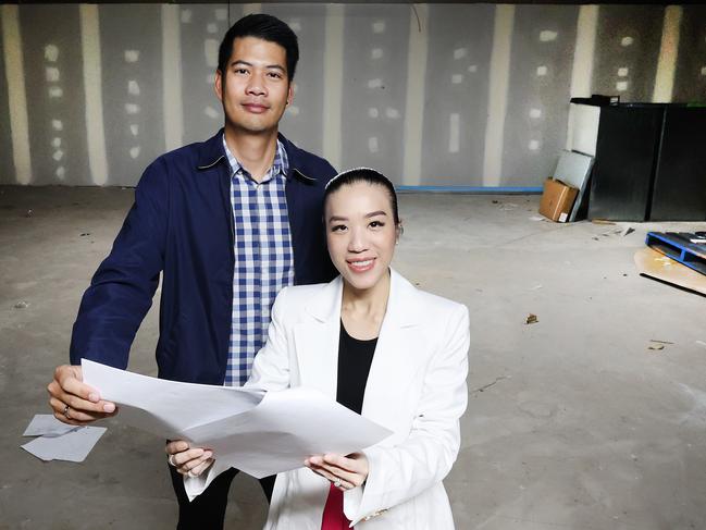 The iconic space that was once Charlie's Cafe in Surfers Paradise is about to be home to the Glitter Strip's newest Thai resturant. Owners Pattaree Jiranuchaiwattana (Pat on right) and Vitchaya Hasitawet (Alex) check the plans for the new space signed the lease this week with construction on the space starting later in the year with an opening penciled in for November. Picture Glenn Hampson