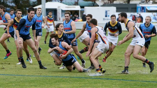 How will SANFL clubs compete with AFL-listed opponents from Adelaide and Port Adelaide into the future? Picture: AAP/Emma Brasier