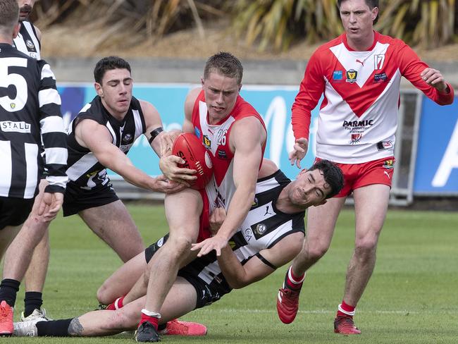 Clarence’s Jack Preshaw is tackled by Glenorchy’s Harrison Gunther. Picture: Chris Kidd