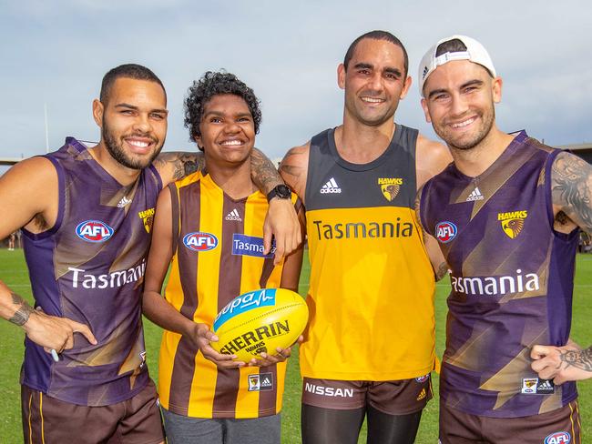 Ceberio (Cebby) Johnson is a 14  year old boy originally from Tenant Creek and Hawthorn's Number 1 fan. The Hawthorn footy club met Cebby a couple of years ago, after his foster mum (Tanya Fry)reached out to the club to let them know how obsessed he was with Cyril Rioli and to tell us a little bit about his story.Unfortunately Cebby had a 6 meter fall in August 2018 resulting in head injures and becoming permanently blind. The club has now named Cebby as their No.1 fan and he will be running through the clubs banner before the Hawkes Easter Monday game at the MCG.L-R Jarmen Impey, Cebby, Shaun Burgoyne and Chad Wingard at Hawkes training session. Picture: Sarah Matray