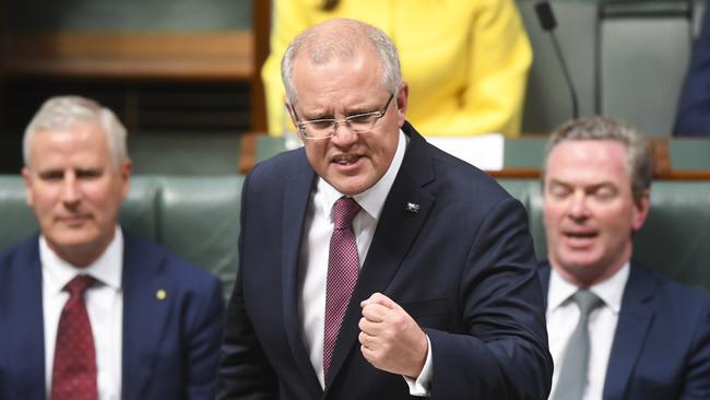 Prime Minister Scott Morrison, flanked by Deputy PM Michael McCormack (left) and Defence Minister Christopher Pyne, speaks during Question Time at Parliament House in Canberra. Picture: AAP