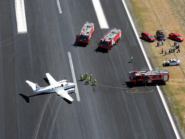  SA aeroplane accident scene after a light aircraft performed an emergency landing when landing gear failed at Adelaide Airport. Picture: Channel 7 helicopter.