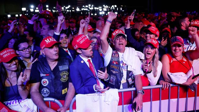 Supporters at the Palm Beach Convention Center react while watching returns come in for Donald Trump. Picture: Chip Somodevilla/Getty Images/AFP