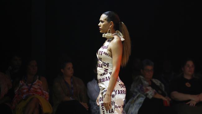 Sarah Eggmolesse models the Yarrabah Affirmations collection by the Yarrabah Arts & Culture Precinct at the Cairns Indigenous Art Fair fashion performance, Woven, held at the Tanks Arts Centre, Edge Hill. Picture: Brendan Radke