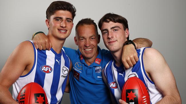 L-R 3rd pick Harry Sheezel, North Melbourne coach Alastair Clarkson, 2nd pic George Wardlaw represent what is hopefully a bright future at Arden St. Picture by Michael Klein