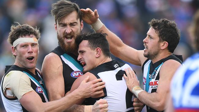 Charlie Dixon celebrates a goal with teammates. Picture: AAP Images