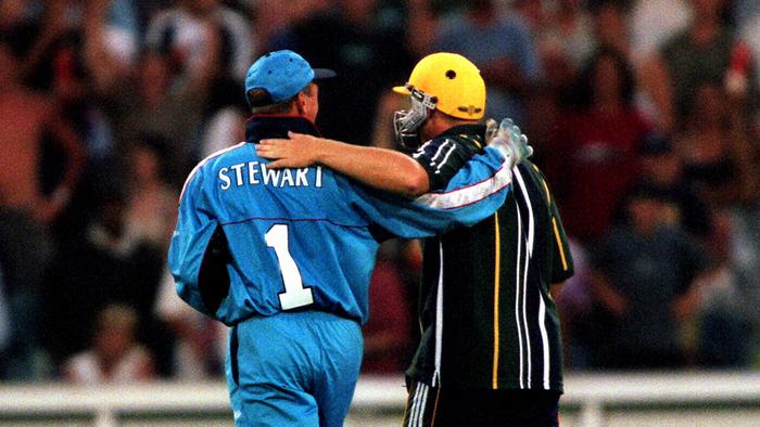 Cricketer Alec Stewart (l) with Shane Warne approaching MCG crowd to ask spectators to stop throwing objects on to the ground. Cricket - Australia vs England tri-nation one day international match at the MCG 15 Jan 1999. 
/Cricket/World/Series/Cup