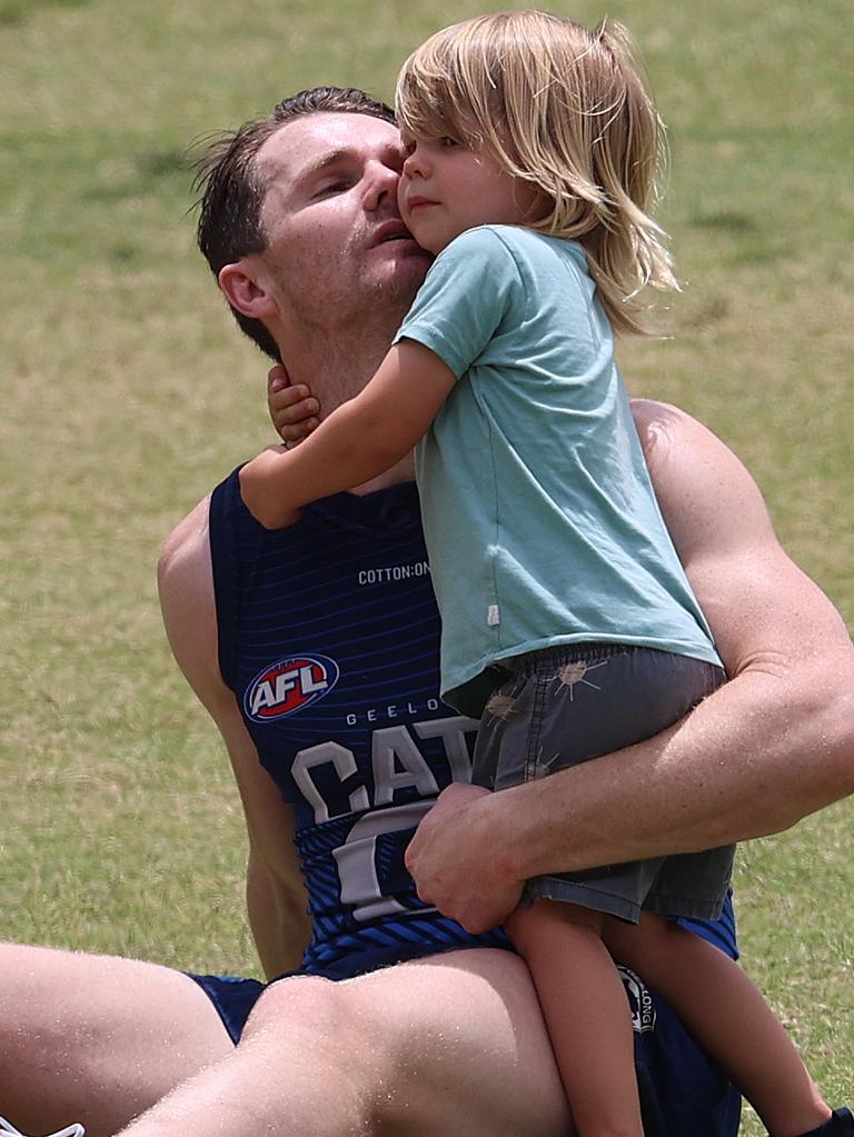 Patrick Dangerfield gets a hug from his son George. Picture: Michael Klein