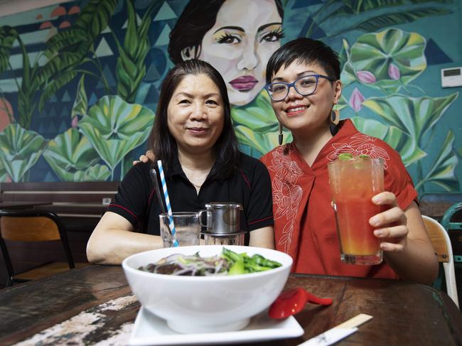 Local cafe owner Maggie Nguyen and her mum Kim Nguyen posing at Cafe Oh-Mai, 15 Cracknell Rd, Annerley, Brisbane, 5th of March 2020. (AAP Image/Attila Csaszar)