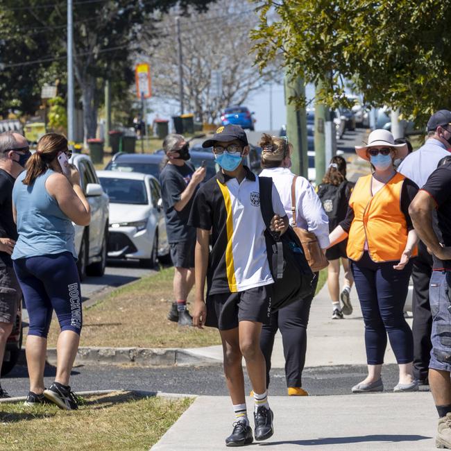 Hundreds of cars fill the streets around Sir Thomas More School at Sunnybank as parents rush to pick up their children after two cases of COVID-19 were detected in the school. Picture: Sarah Marshall