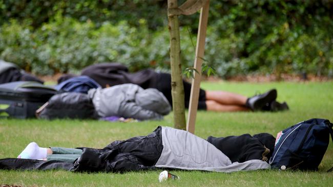 Homeless people sleeping rough in Emma Miller Place on Roma Street. Picture: David Clark