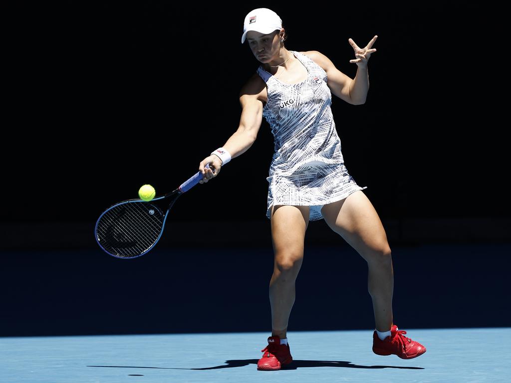 MELBOURNE, AUSTRALIA - JANUARY 19: Ashleigh Barty of Australia plays a forehand in her second round singles match against Lucia Bronzetti of Italy during day three of the 2022 Australian Open at Melbourne Park on January 19, 2022 in Melbourne, Australia. (Photo by Darrian Traynor/Getty Images)