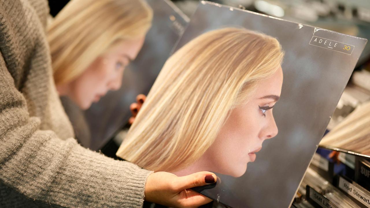 A member of staff sorts copies of the new album from British singer-songwriter Adele, "30" in Sister Ray record store in the soho area of central London. Picture: Tolga Akmen / AFP