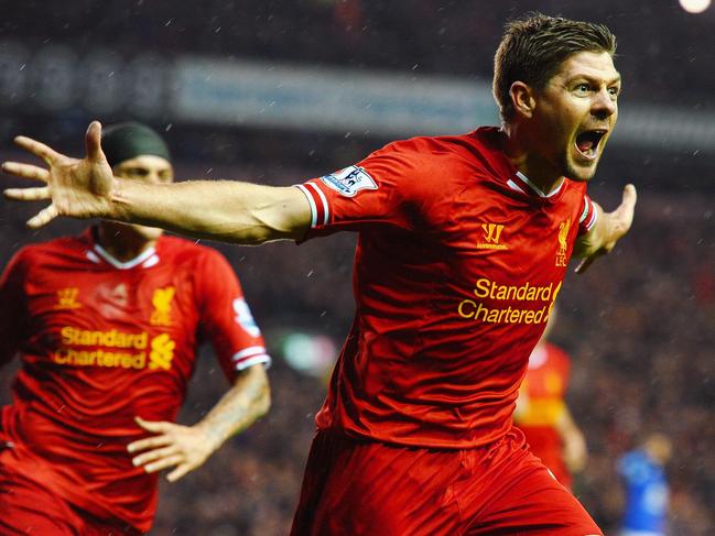 LIVERPOOL, ENGLAND - JANUARY 28: Steven Gerrard of Liverpool celebrates after scoring the opening goal during the Barclays Premier League match between Liverpool and Everton at Anfield on January 28, 2014 in Liverpool, England. (Photo by Laurence Griffiths/Getty Images)