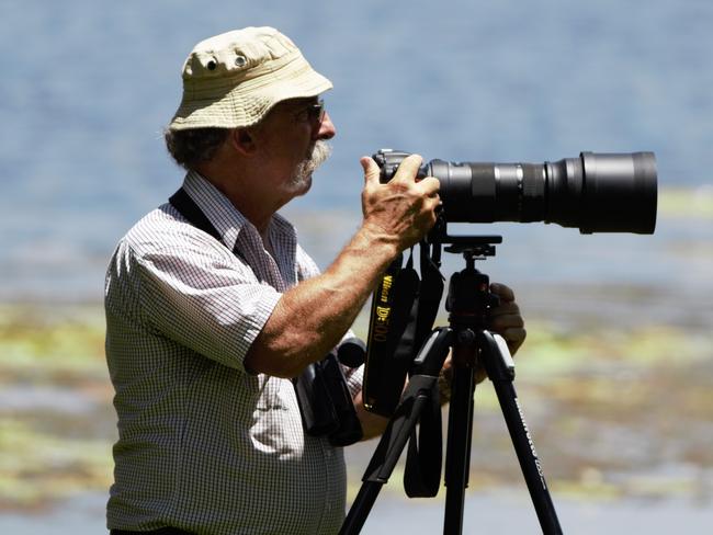 Naturalist John Young photographing birds. Picture: Supplied