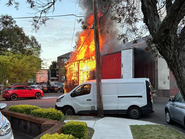 Residents nearby watched as the delivery truck caught on fire after bringing down power lines. Picture: Facebook