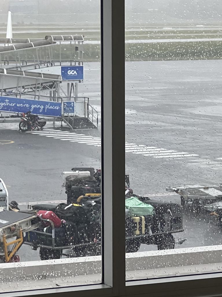 Luggage seen outside during heavy rain on the Gold Coast on Wednesday. Picture: Ian Duckworth.