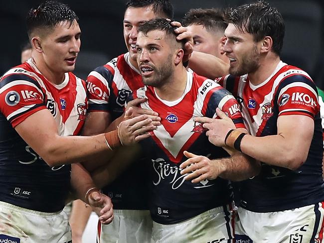 SYDNEY, AUSTRALIA - MAY 29: James Tedesco of the Roosters celebrates with his team mates after scoring a try during the round three NRL match between the Sydney Roosters and the South Sydney Rabbitohs at Bankwest Stadium on May 29, 2020 in Sydney, Australia. (Photo by Mark Kolbe/Getty Images)