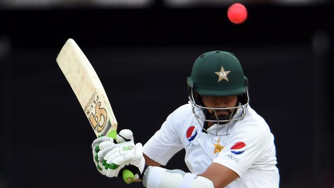 Azhar Ali scored a defiant half century against Australia as he reached 1000 runs for the year.