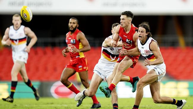 Ben Ainsworth of the Suns gets a kick out. Picture: AAP / Dave Hunt