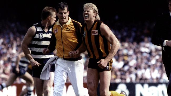 Dermott Brereton grimaces in pain during the 1989 Grand Final against Geelong. Picture: Supplied