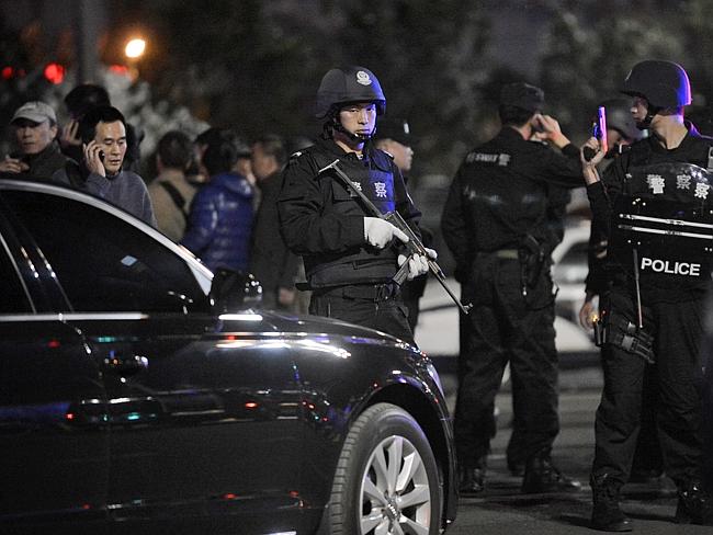 Police officers ... investigate and protect the crime scene outside a railway station in Kunming, in south-western China's Yunnan province. Picture: AP