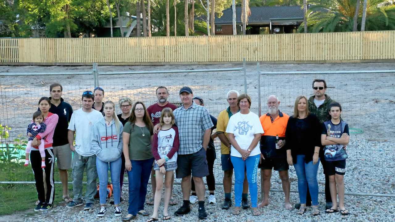 BACKYARD BATTLE: Residents on Laloki St, Camira are desperately fighting to stop a subdivision and construction of a duplex going ahead in their street.