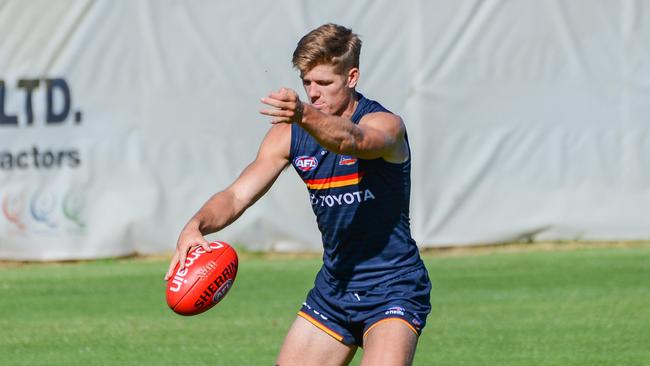 Nick Murray gets a kick away at Crows training.