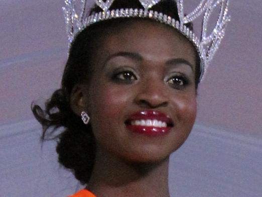 In this Sunday, April, 26, 2015 photo Miss Zimbabwe, Emily Kachote, walks on stage after been crowned. Miss Zimbabwe has been stripped of her title after photographs emerged of the now former beauty queen posing naked. Pageant organizers said Emily Kachote would no longer represent Zimbabwe in the Miss World pageant held in China later this year. (AP Photo)