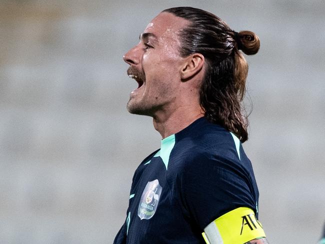 ABU DHABI, UNITED ARAB EMIRATES - JANUARY 6: Australia's captain Jackson Alexander Irvine reacts after a goal by Mitchell Thomas Duke in the international friendly against Bahrain on January 6, 2024 in Abu Dhabi, United Arab Emirates. (Photo by Martin Dokoupil/Getty Images)