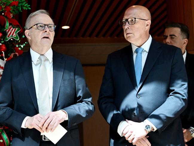 Prime Minister Anthony Albanese talks with Opposition Leader Peter Dutton at the Wishing Tree at Parliament House in Canberra. Picture: Tracey Nearmy/AFP