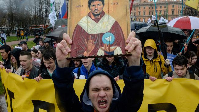 Demonstrators with a icon stylised painting depicting Telegram's founder Pavel Durov protest against the blocking of the popular messaging app in Russia, during a May Day rally in Saint Petersburg on May 1, 2018. Picture: AFP.