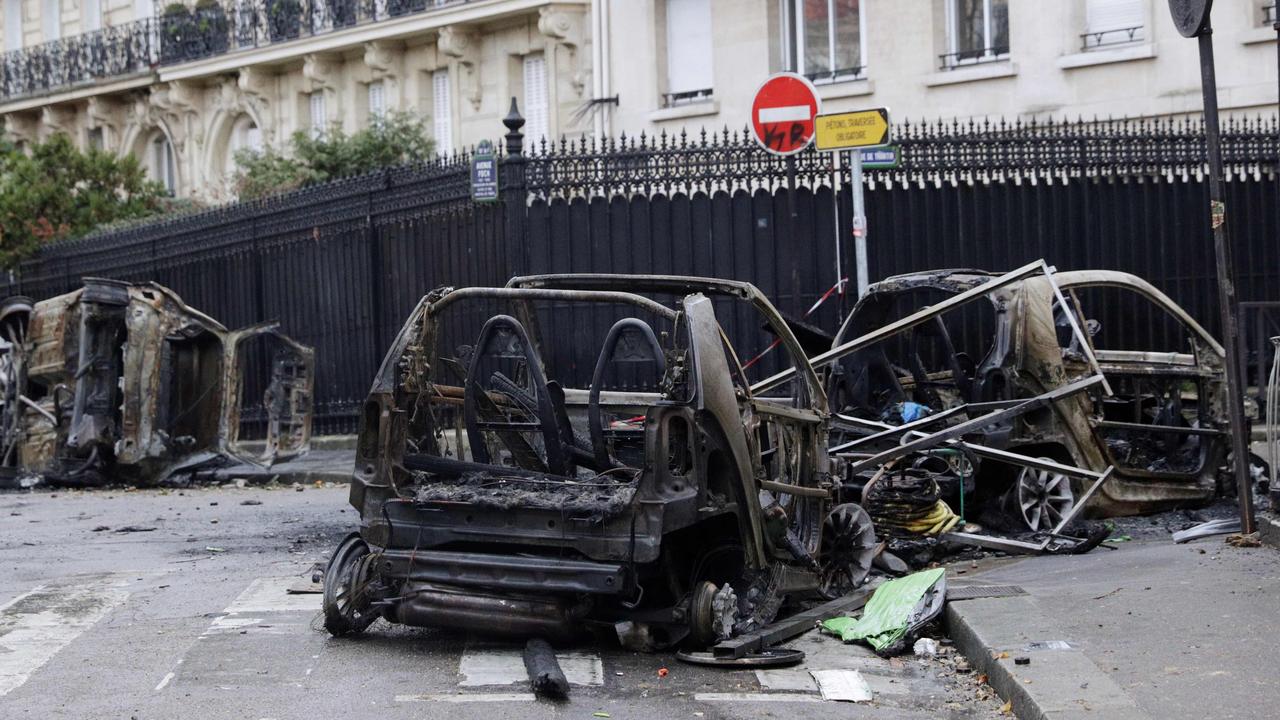 Burned cars in a street of Paris. Picture: AFP