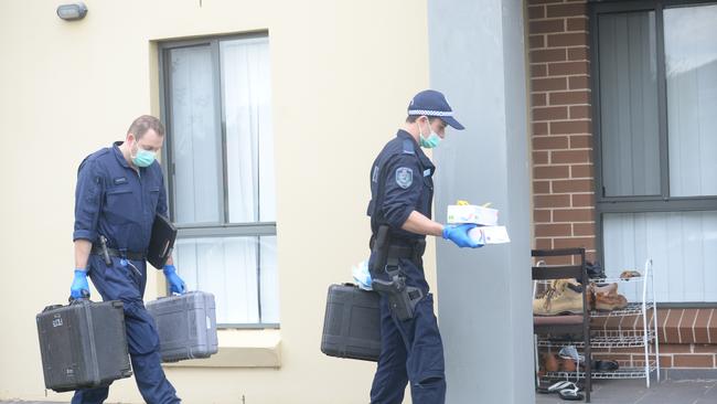 Forensic police officers at the scene on Wednesday night. Photo Jeremy Piper