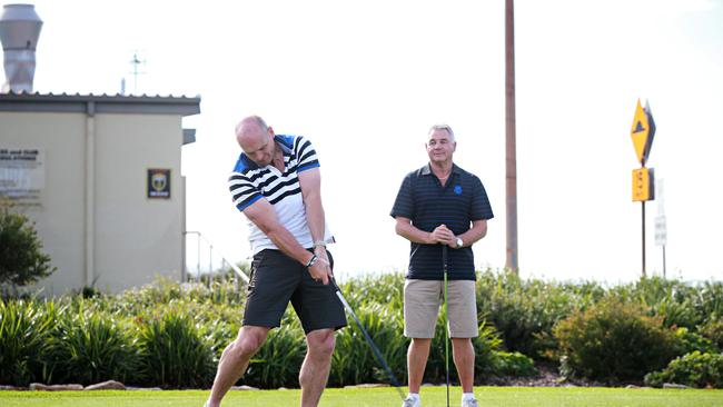 Scottish rugby coach Gregor Townsend fires a shot at Long Reef on Thursday as Rod Macqueen looks on. Picture: Adam Yip.