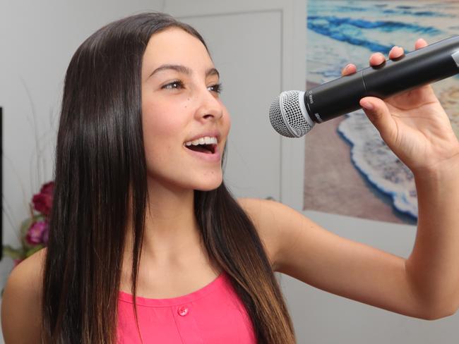 Shaylee Gear, 15, is a Women of The Year nominee, and writes music about overcoming bullies and also paying tribute to her deceased father. Shaylee at home in her music studio.Picture Glenn Hampson