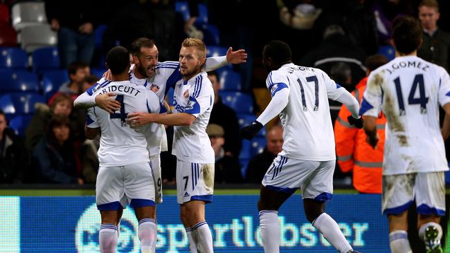 Steven Fletcher (2nd L) of Sunderland celebrates.