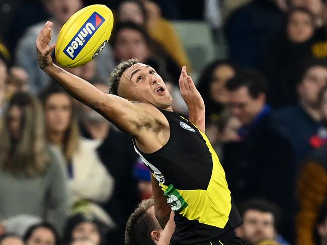 MELBOURNE, AUSTRALIA - APRIL 30: Shai Bolton of the Tigers attempts to mark during the round seven AFL match between the Richmond Tigers and the Western Bulldogs at Melbourne Cricket Ground on April 30, 2021 in Melbourne, Australia. (Photo by Quinn Rooney/Getty Images)