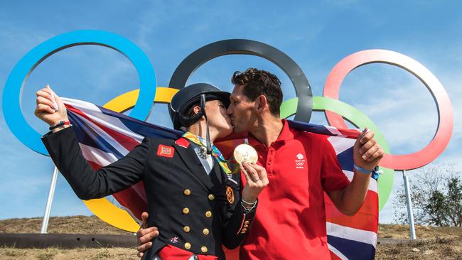 Dujardin kissing her fiance Dean Golding after winning gold at the 2016 Rio Games. (AFP PHOTO/John MACDOUGALL)