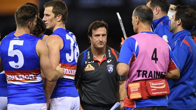 Luke Beveridge after speaking to his players during Round 23.