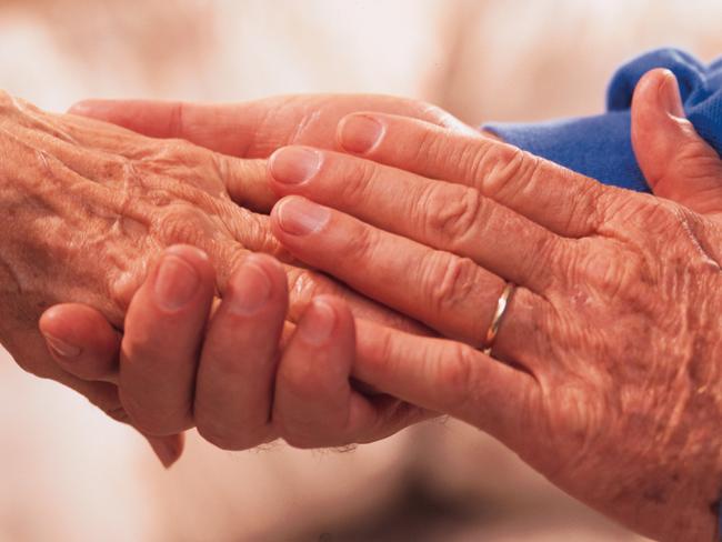 YOUR MONEY ...AGED CARE ..  Senior couple holding hands