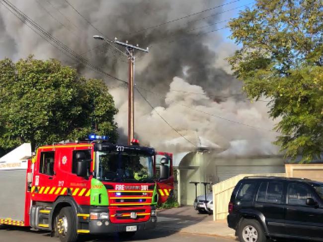 A family of 5 has escaped their burning home at Trinity Gardens. Neighbourson either side also evacuating with fears it would spread. Picture NINE NEW