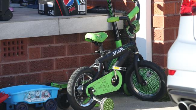 A child’s bike at the house of the alleged bashing. Picture: David Swift