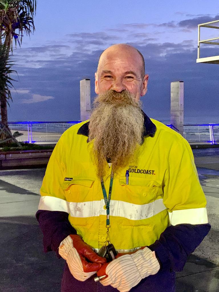 Council worker Mario is a regular early morning sight at Surfers Paradise. Picture Jenny Masters