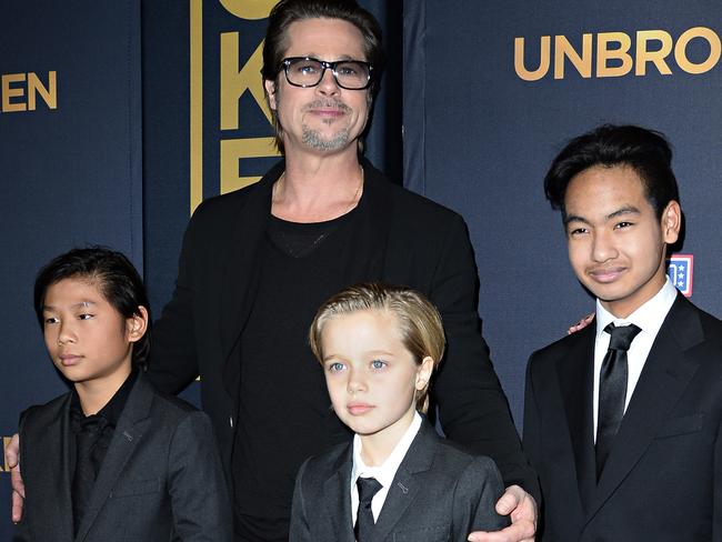 Brad Pitt with his children Pax, Shiloh and Maddox at the Unbroken premiere in California in 2014. Picture: Robyn Beck.